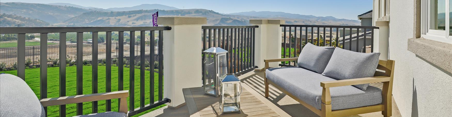 A deck with a chair and a table on it.