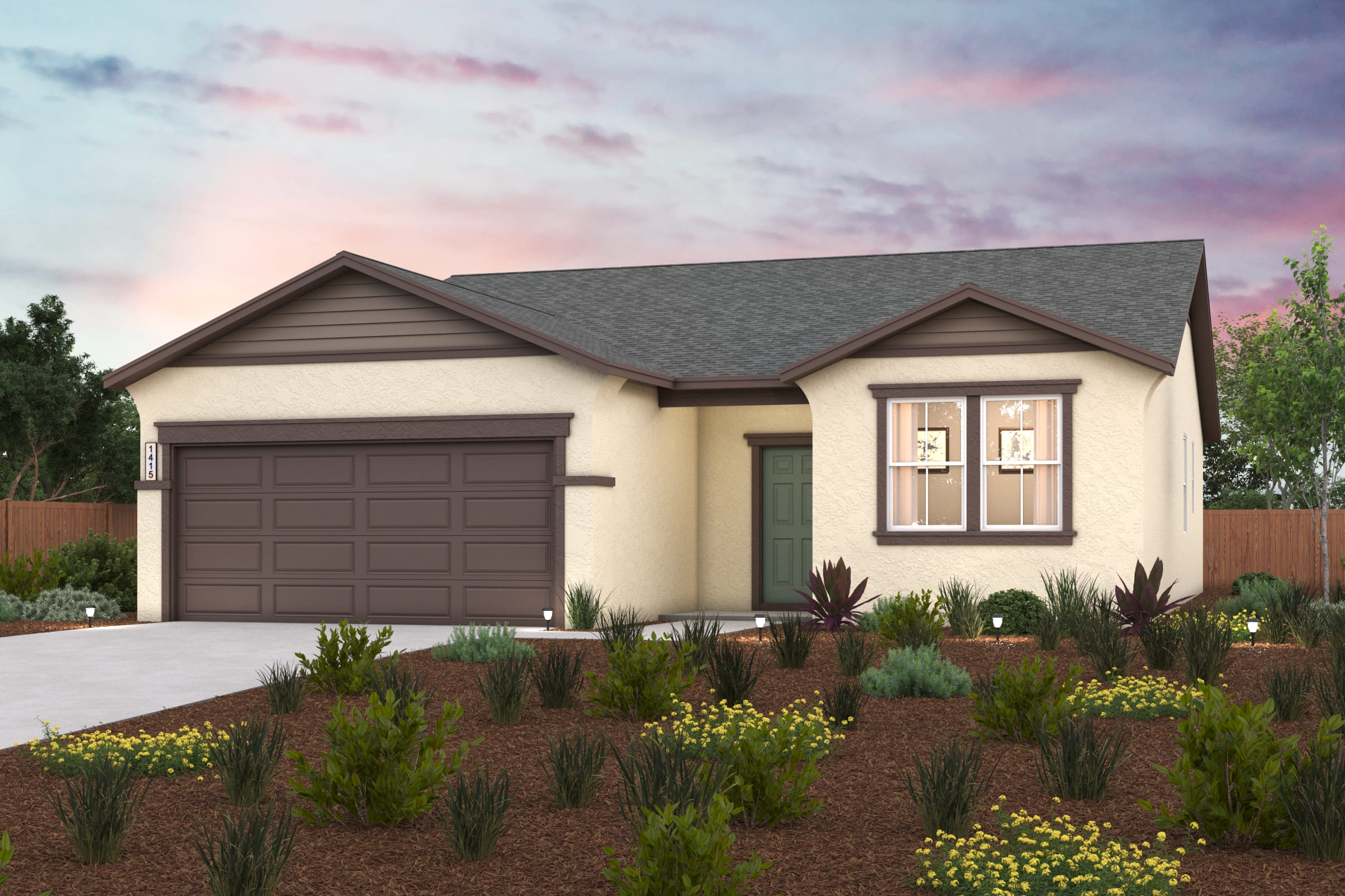 A house with a garage and a garden in front of it.