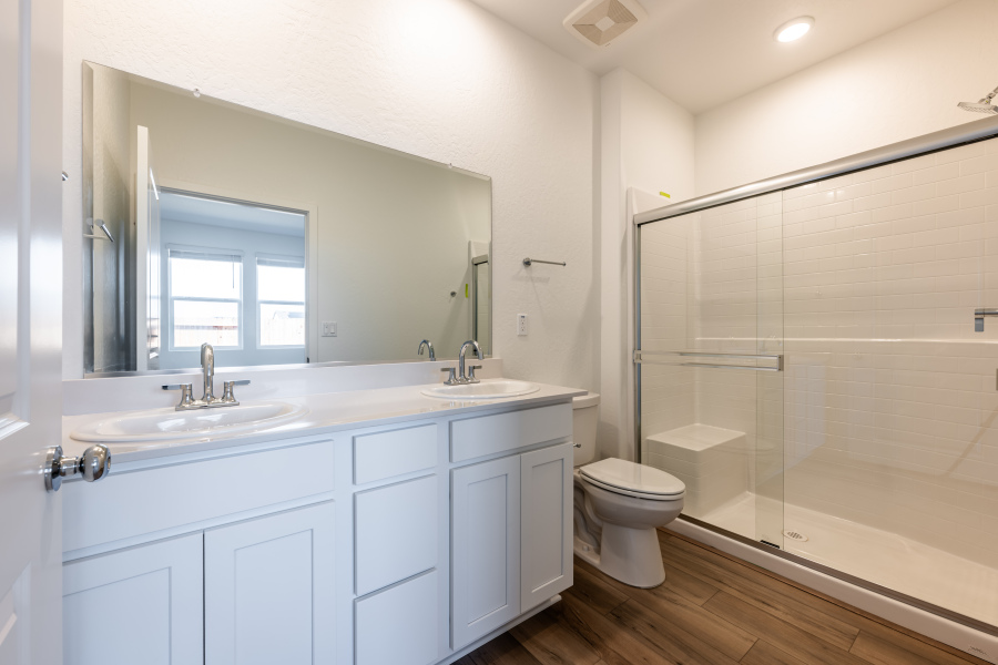 A bathroom with a glass shower.