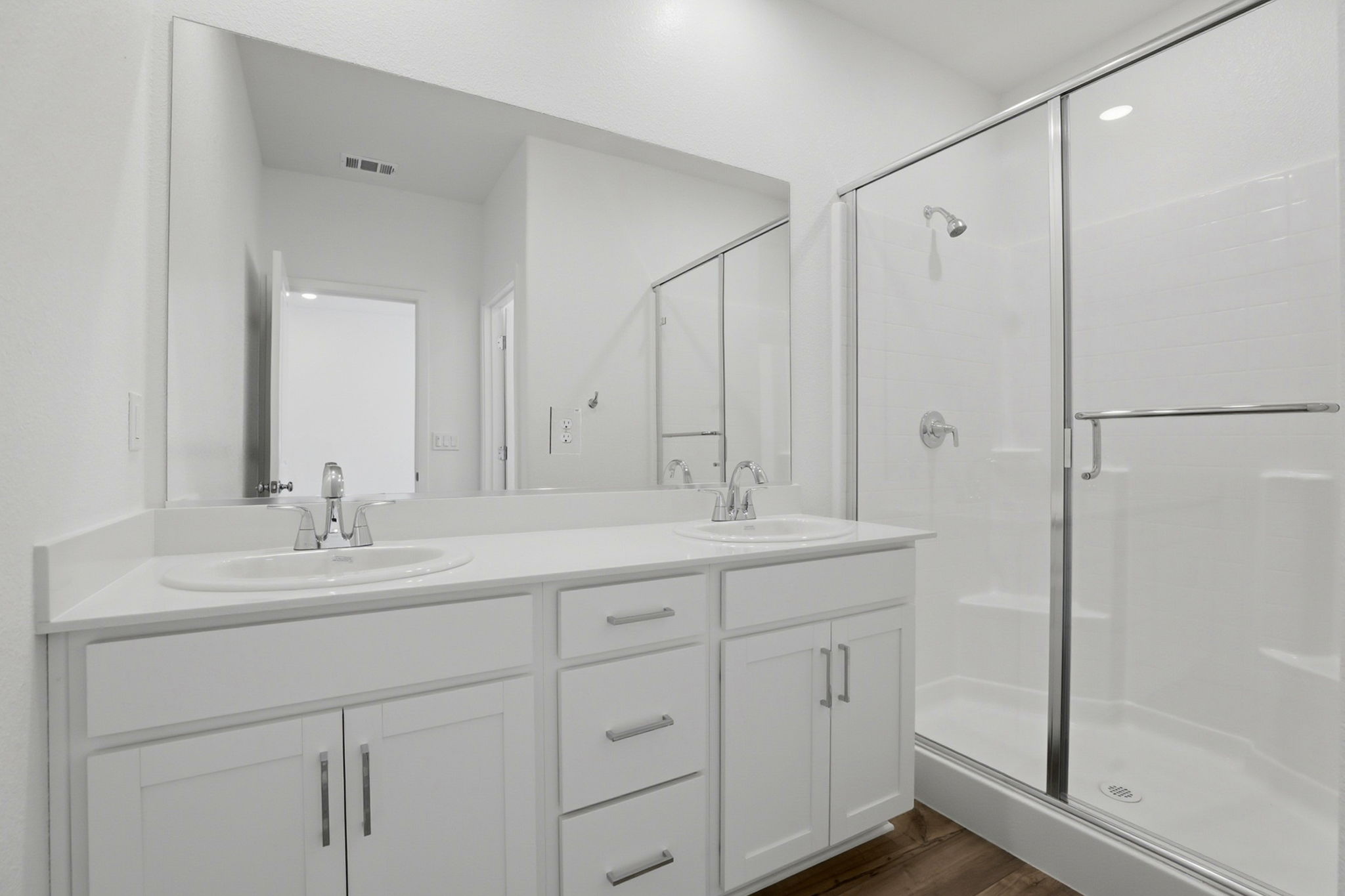 A bathroom with a glass shower.