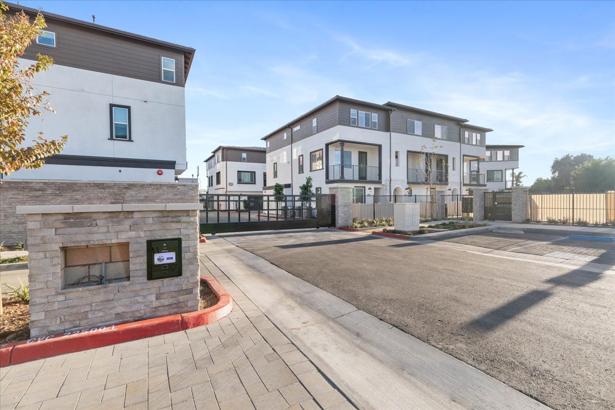 A brick walkway between buildings.