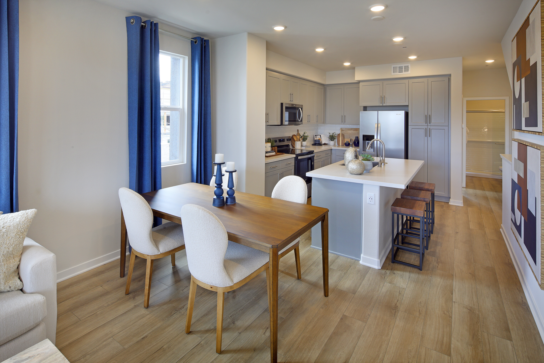 A kitchen with a dining table.