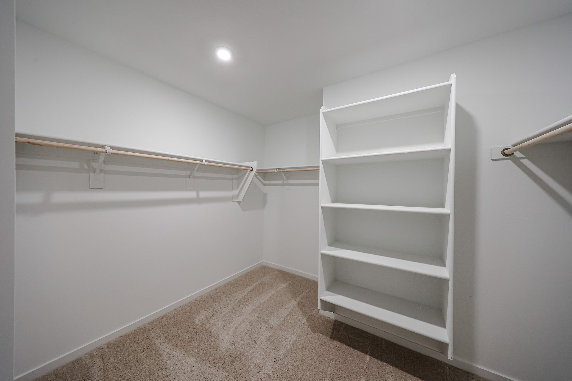 A white shelf in a room.