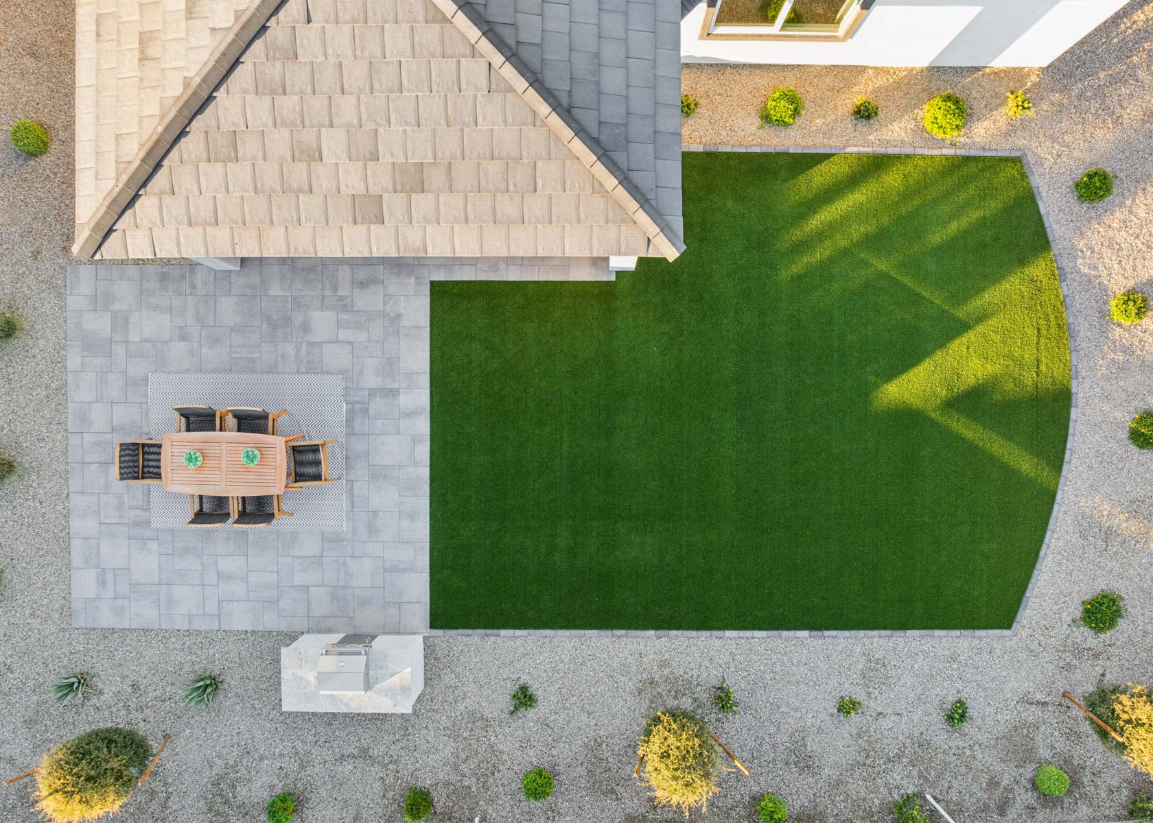 A brick building with a green lawn.
