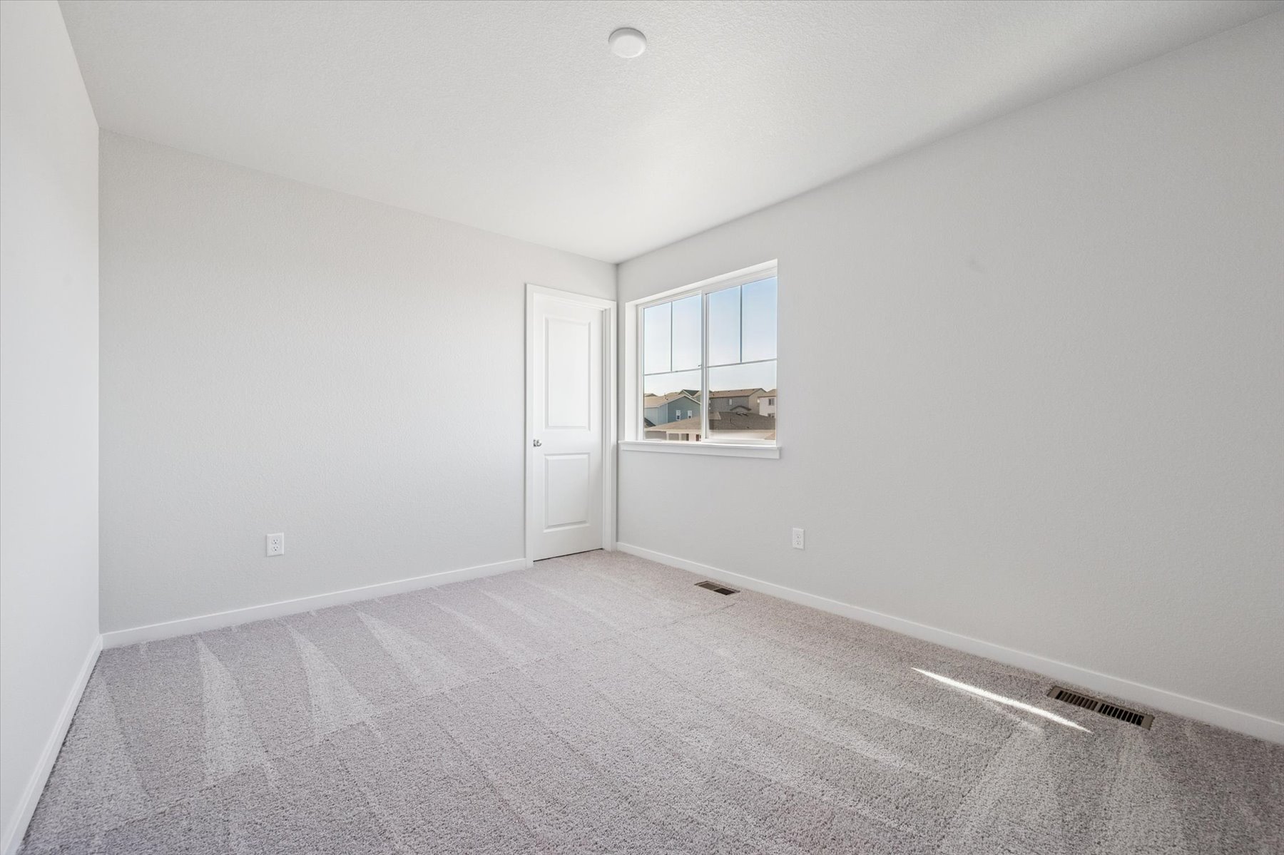 A room with a door and a window.