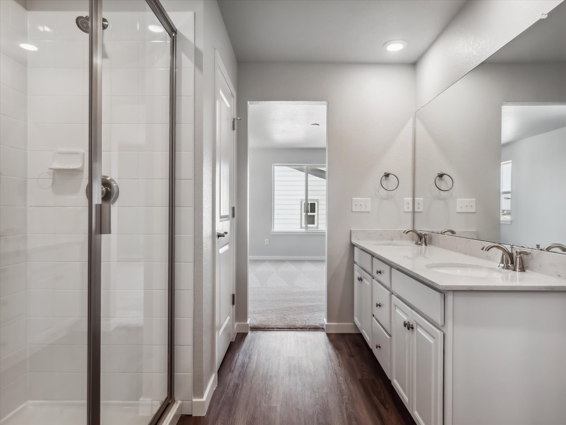 A bathroom with a glass shower.