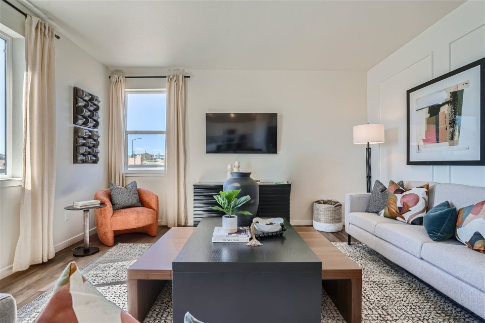 A living room with a tv and couches.