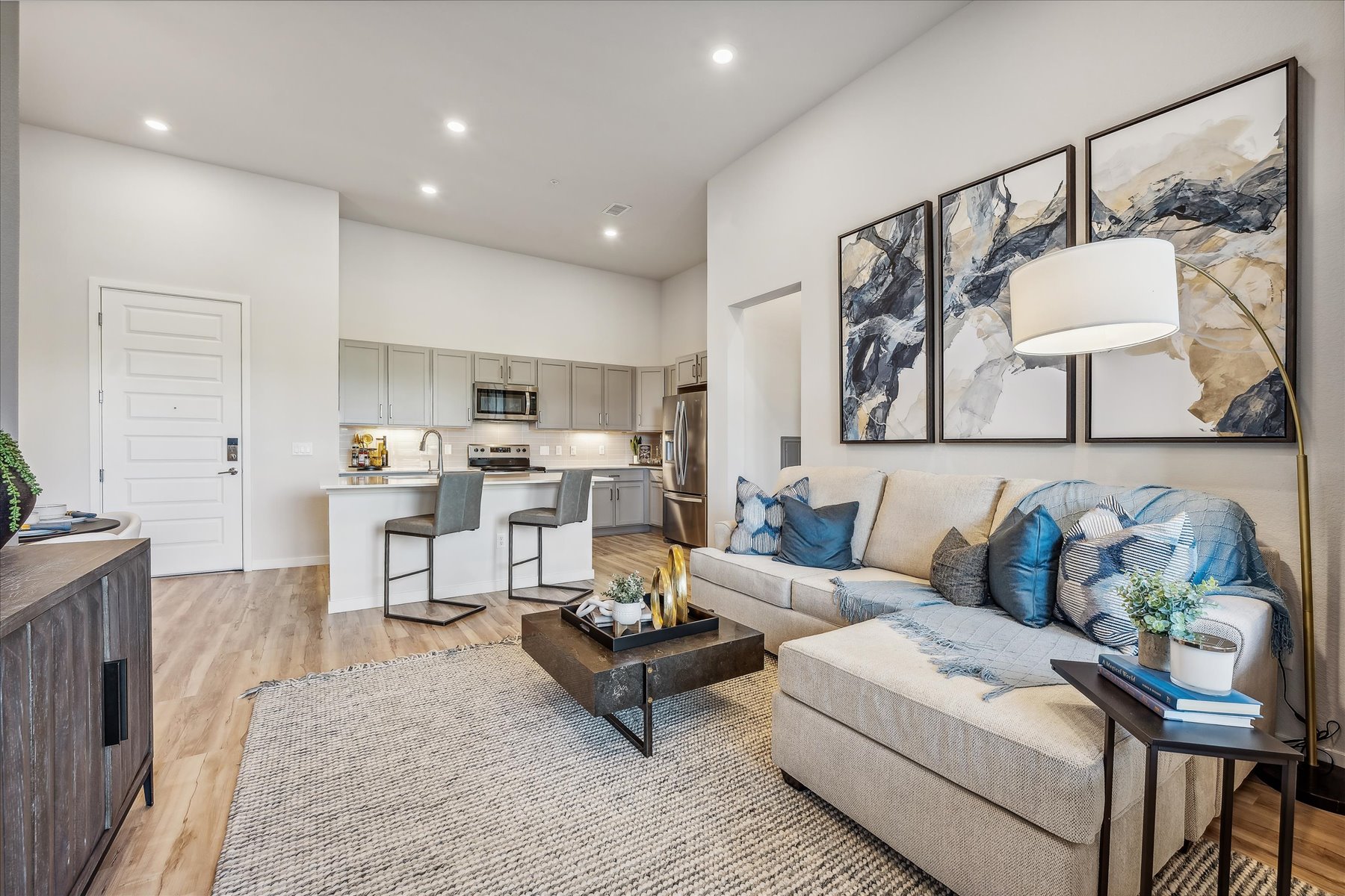 A living room with a couch and a table.