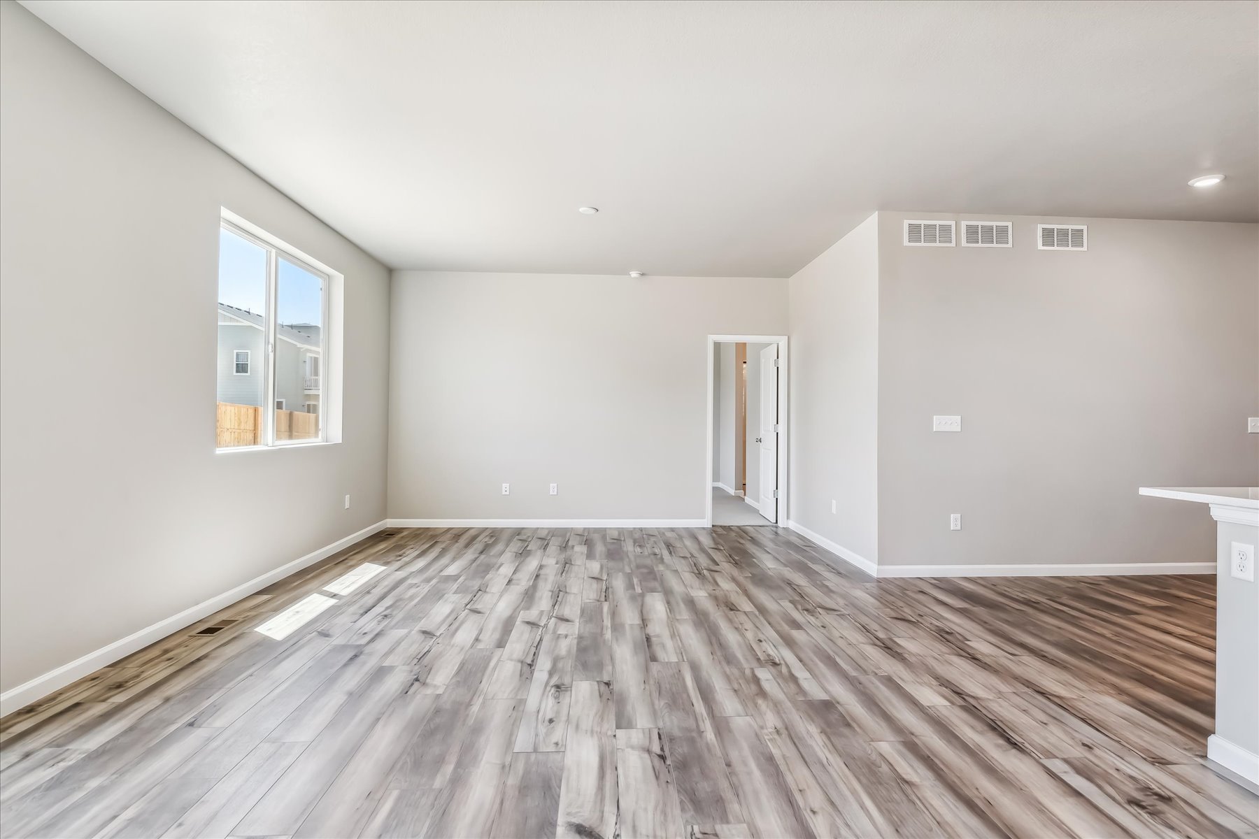 A room with a wood floor and a wood floor.