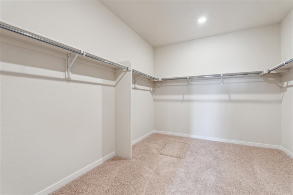 A hallway with white walls.