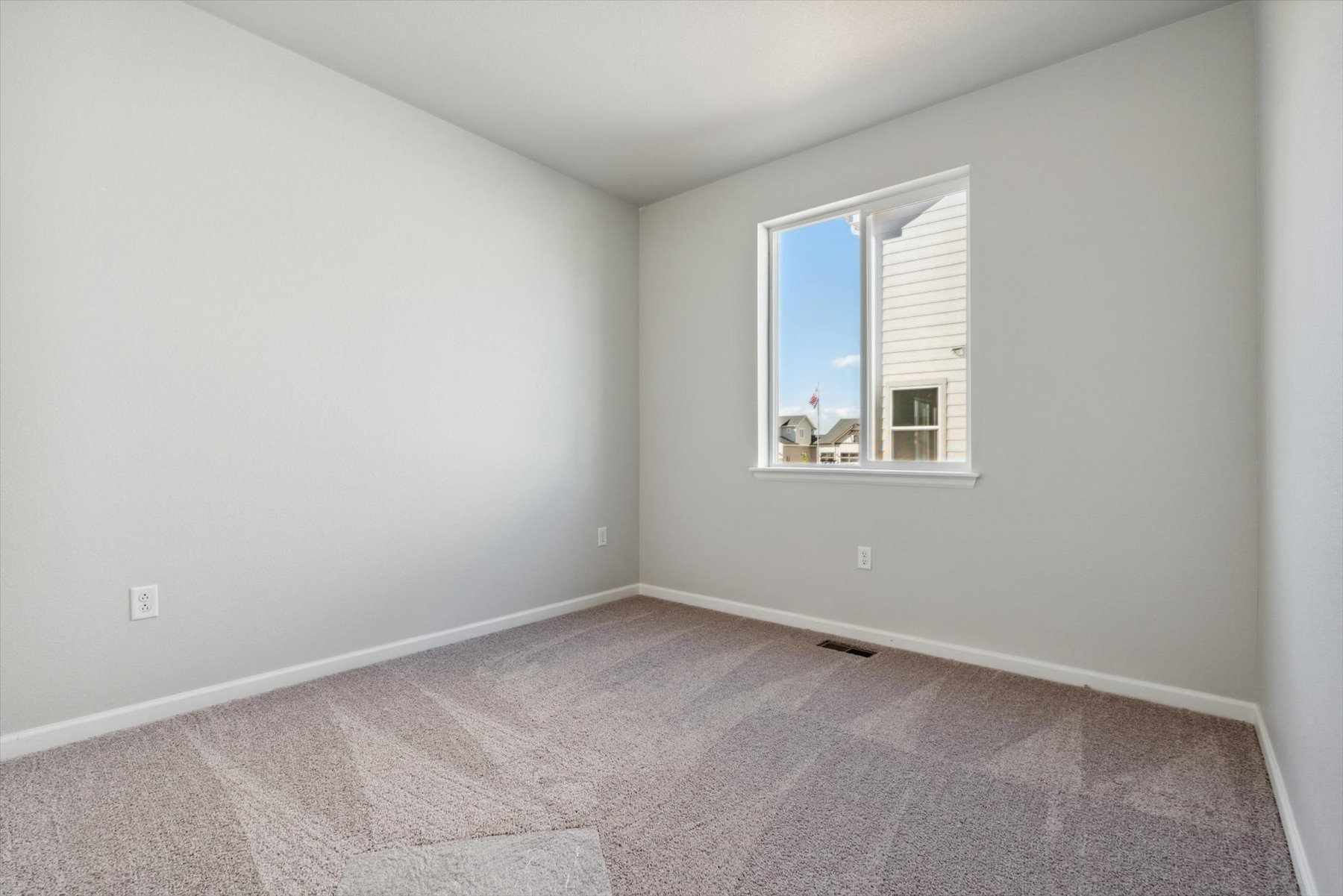 A room with a couple of windows.