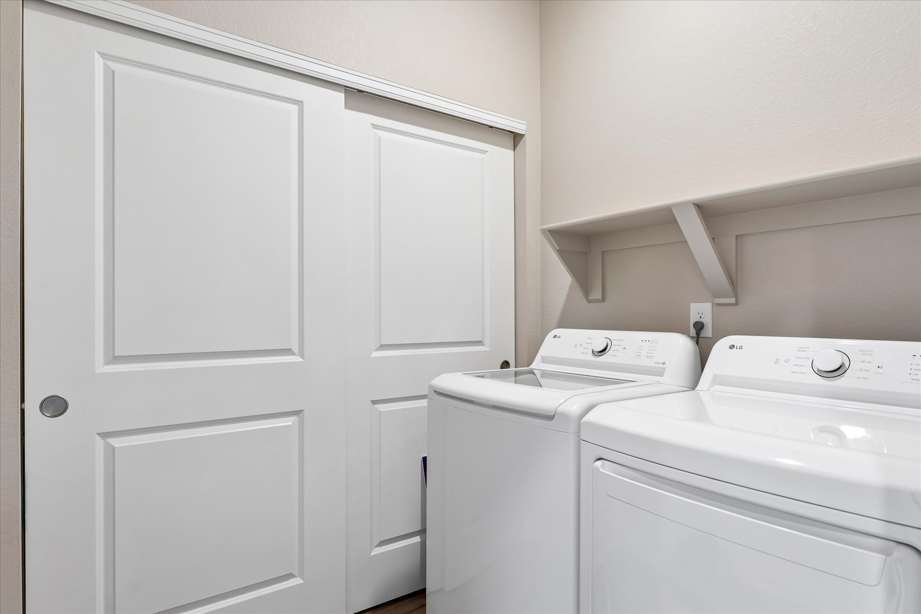 A white kitchen with white cabinets.