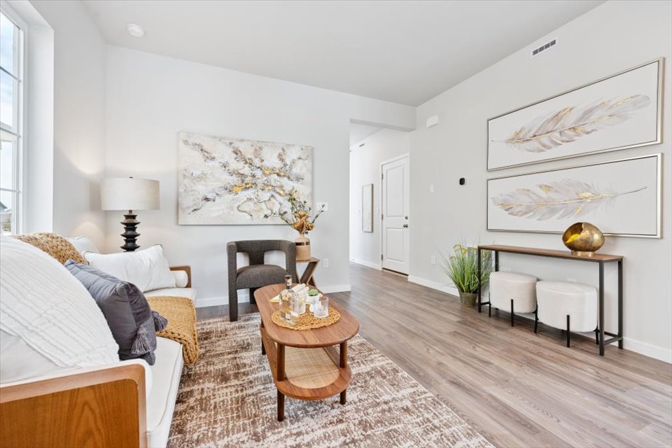 A living room with a wood floor.
