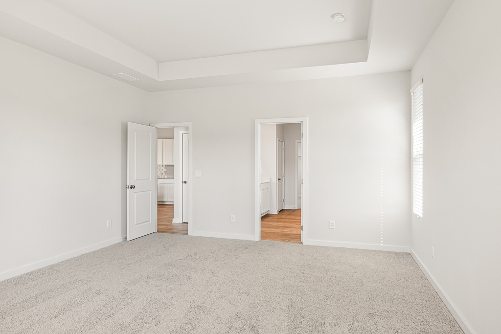 A hallway with white walls.