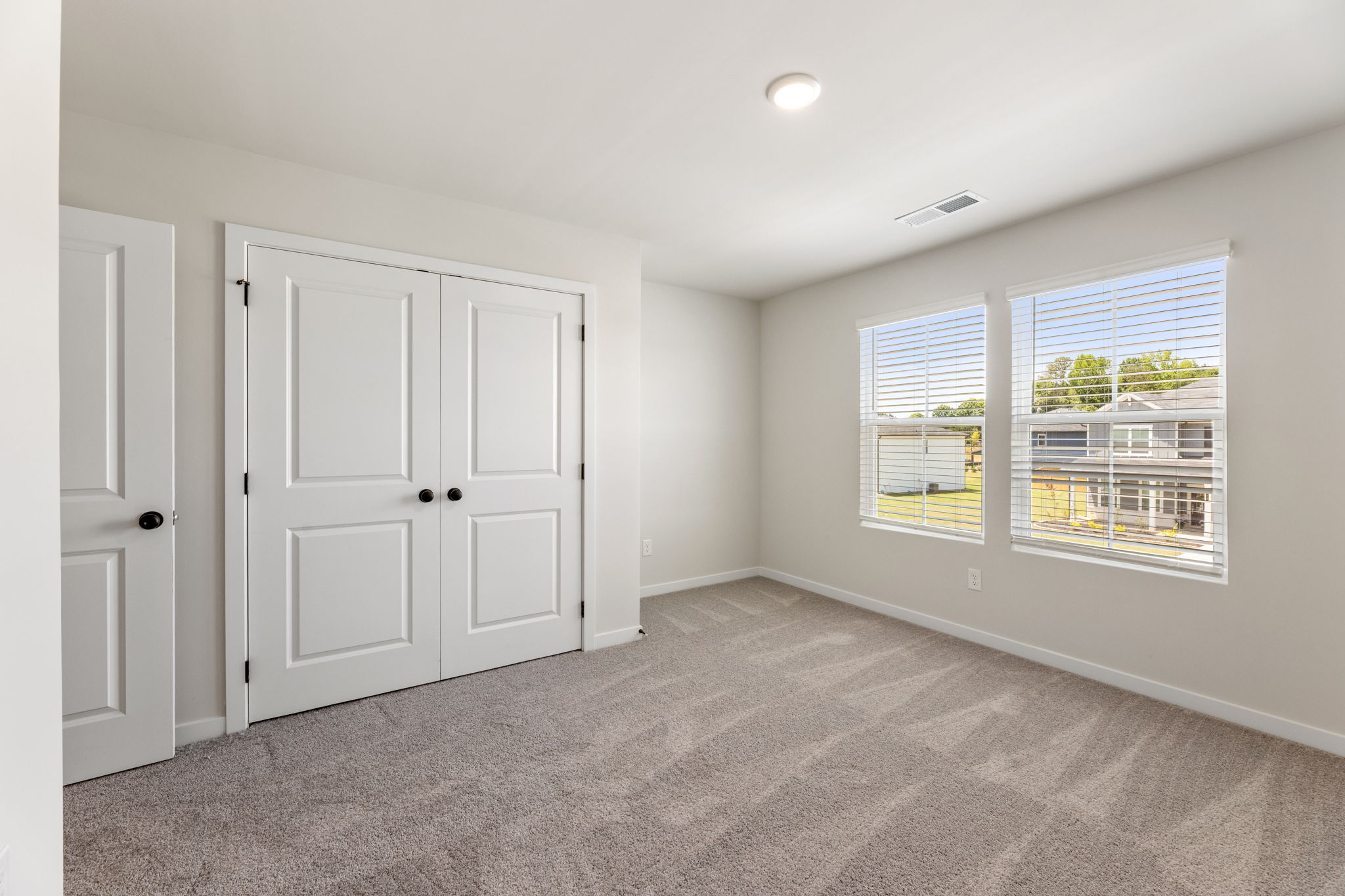 A room with white doors.