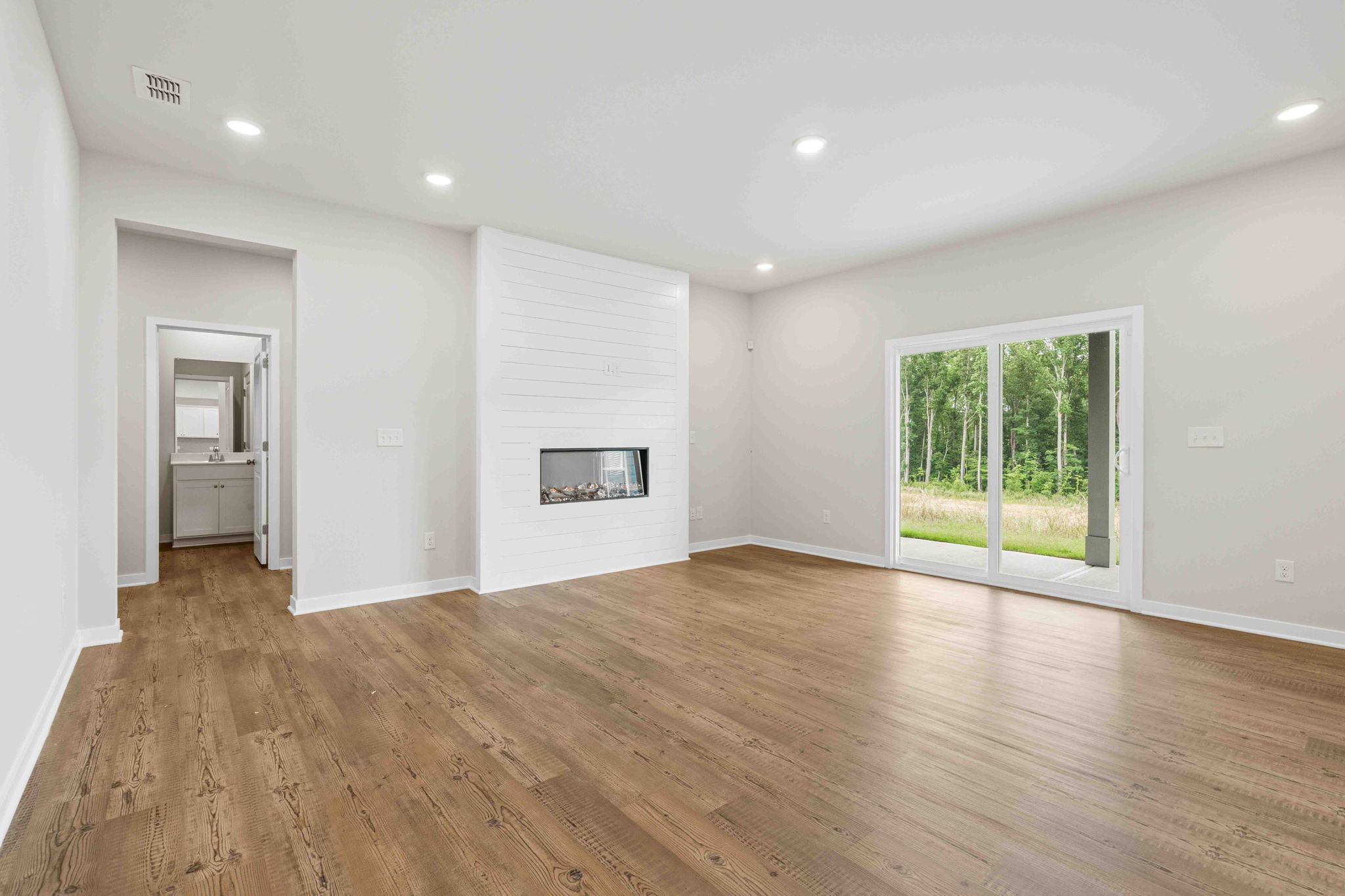 A room with a wood floor and a wood floor.