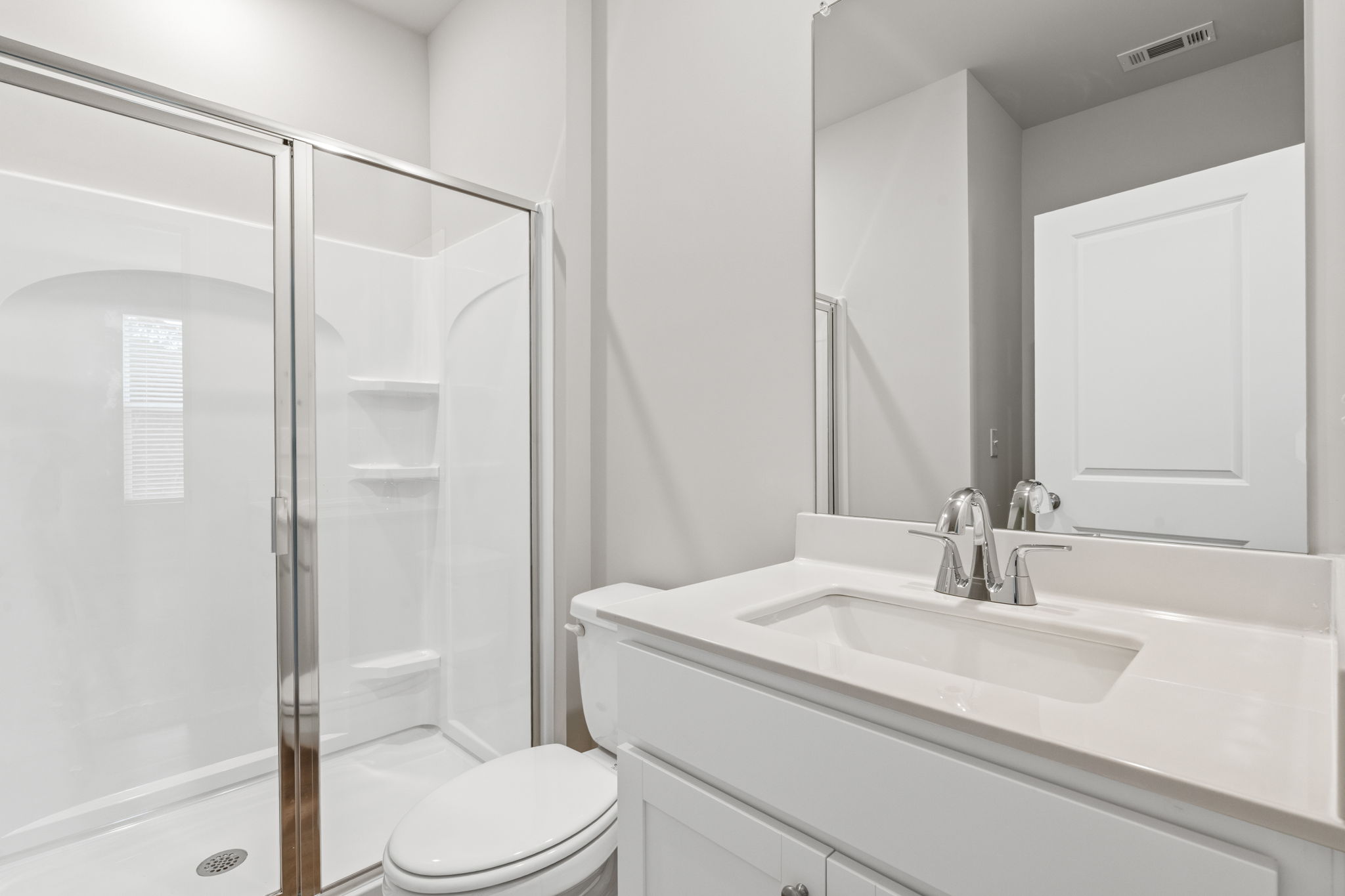 A bathroom with a glass shower.