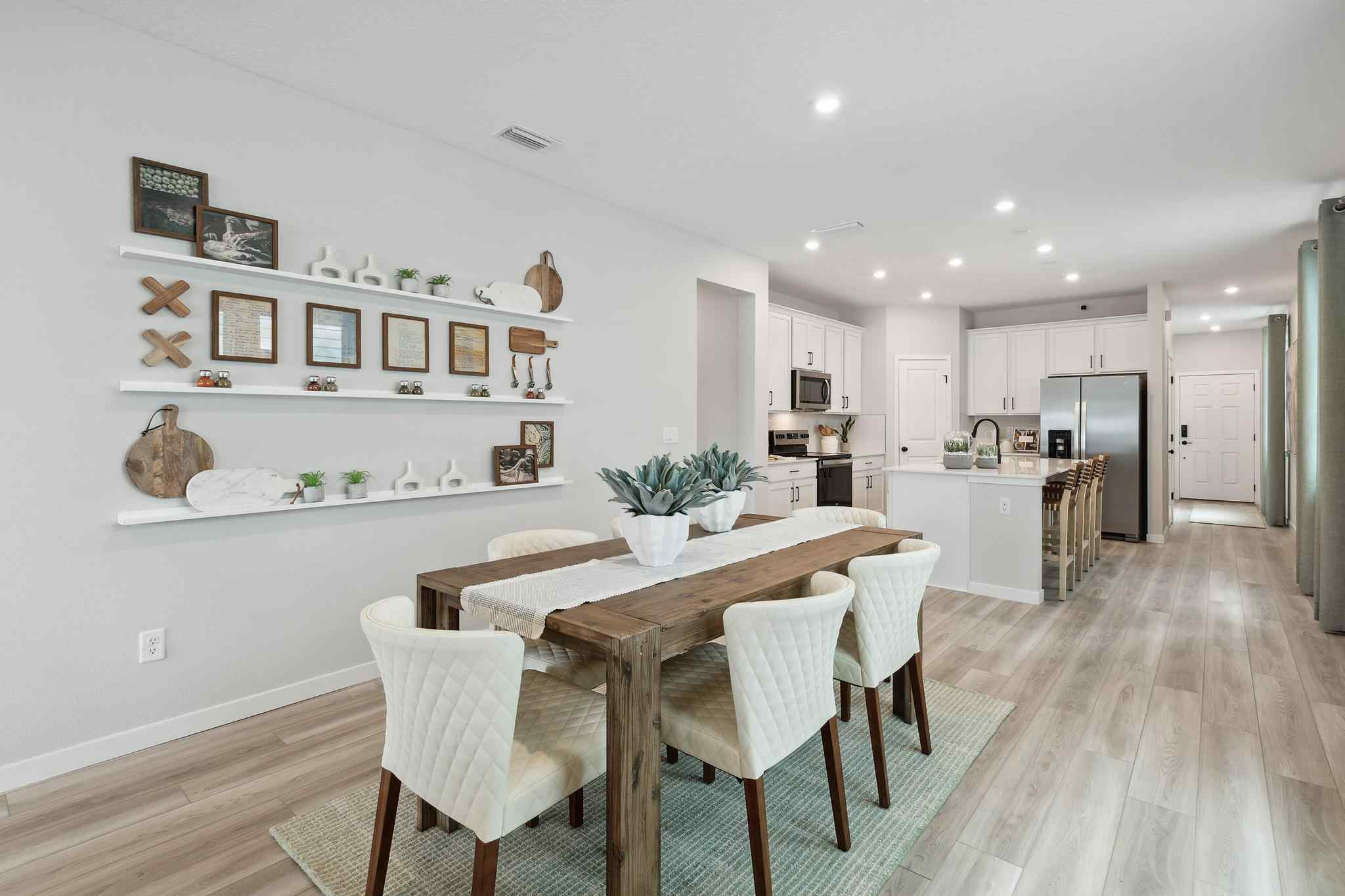A kitchen with a dining table.