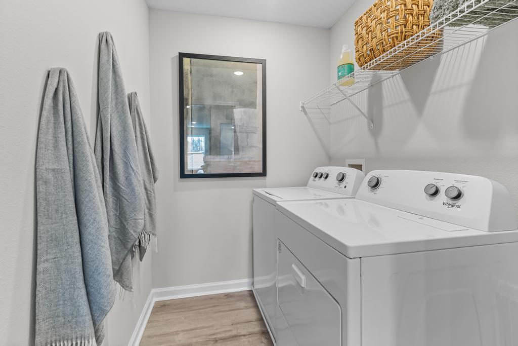 A white washer and dryer in a room.