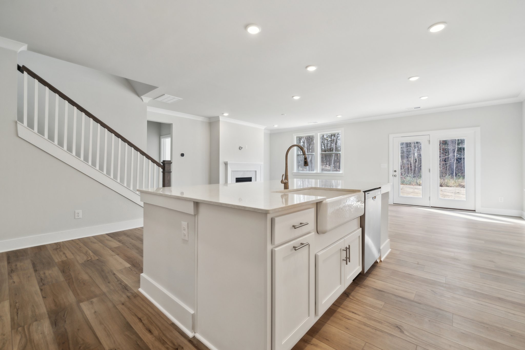 A kitchen with white cabinets.