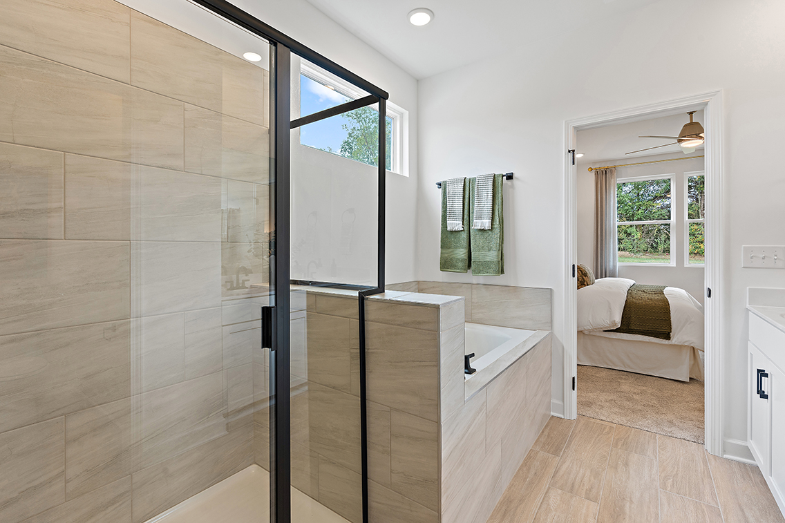 A bathroom with a glass shower.