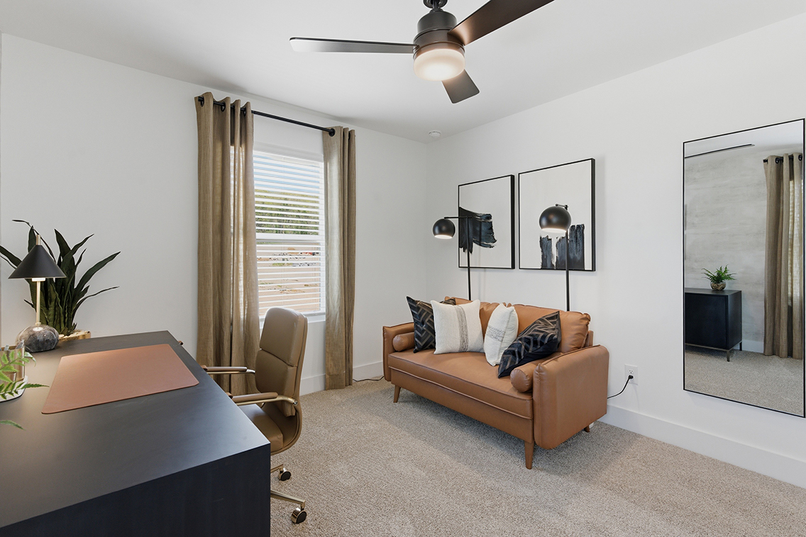 A living room with a couch and a table.
