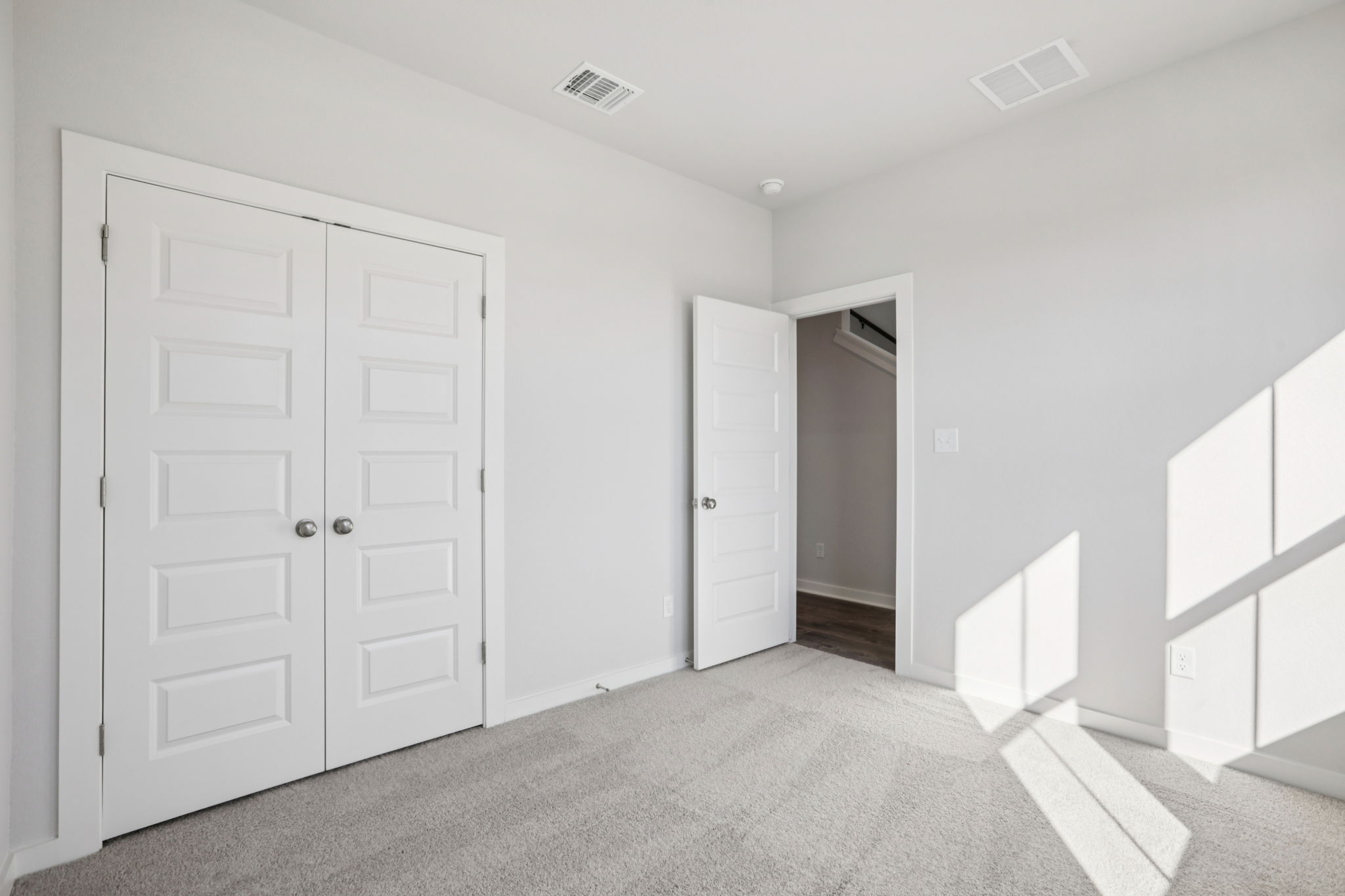 A room with white doors.