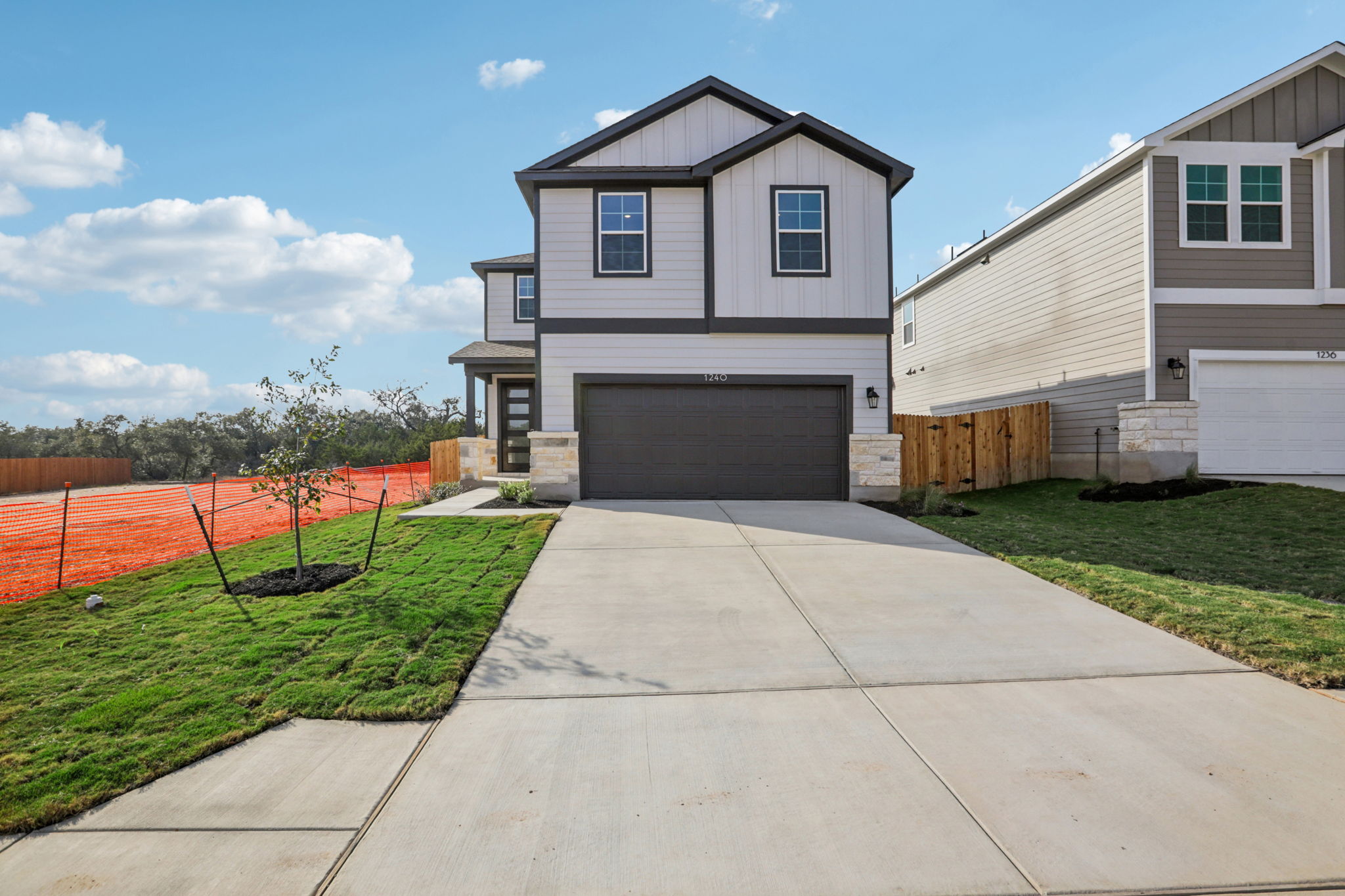 A driveway leading to a house.