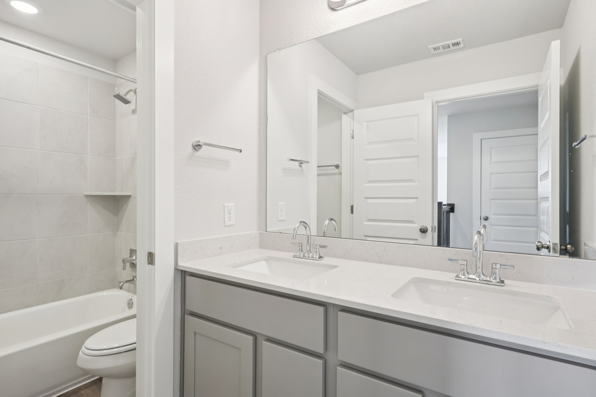 A bathroom with a sink and a toilet.