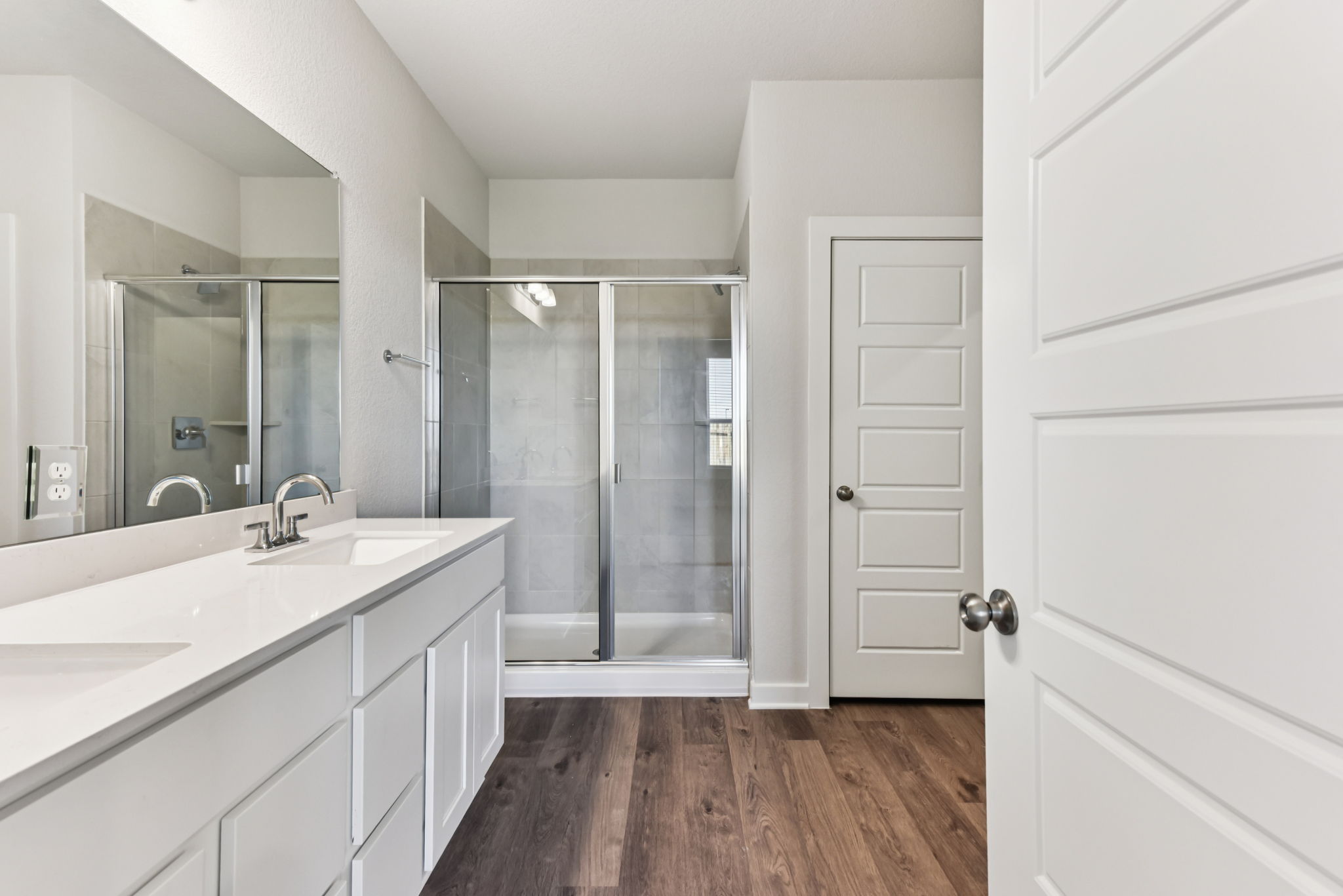 A bathroom with a glass shower.