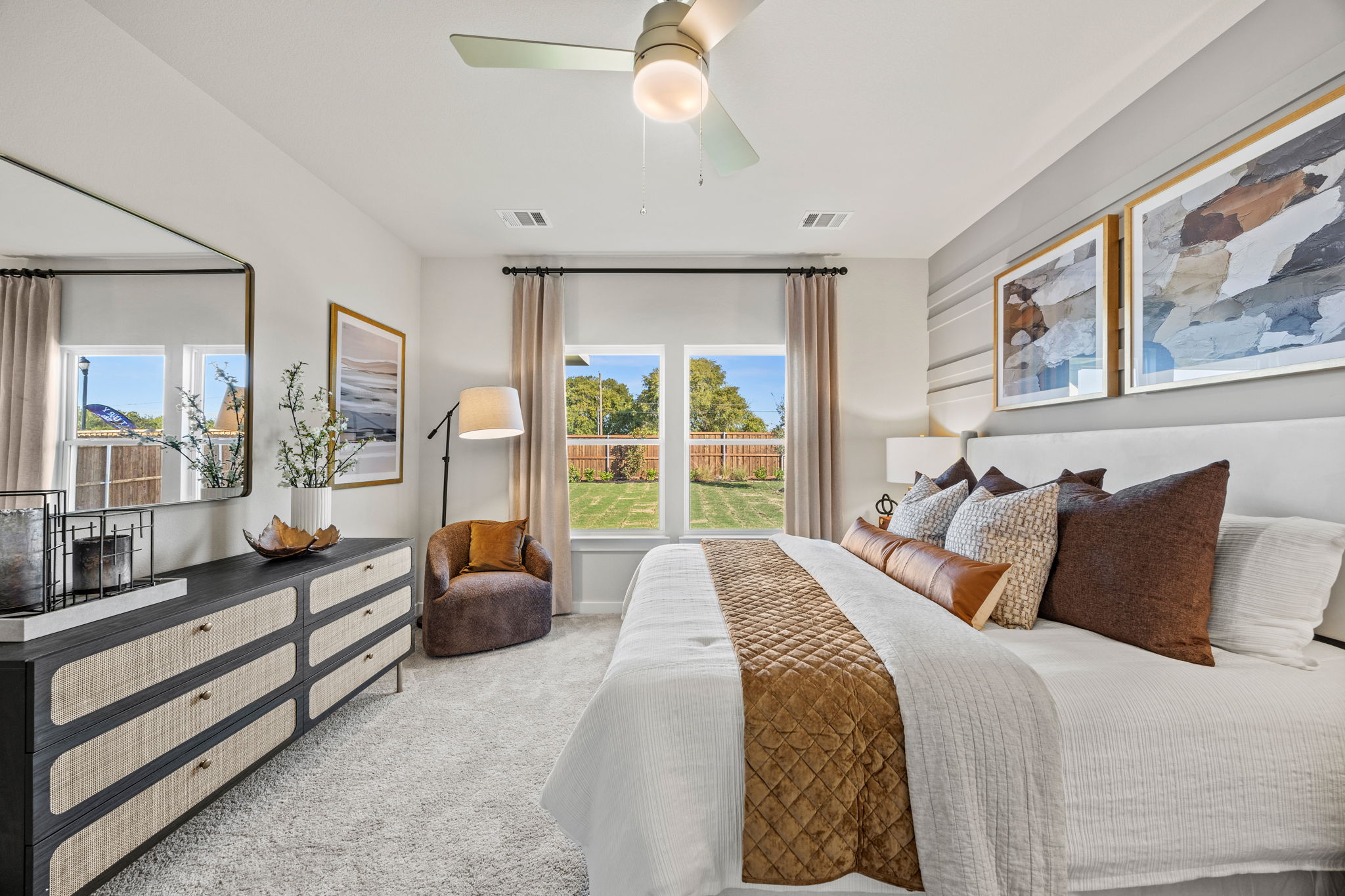 A bedroom with a large window.