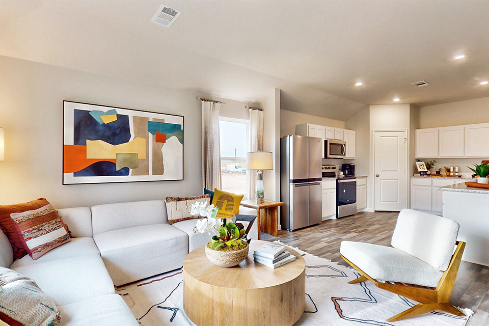 A living room with a couch and a table.
