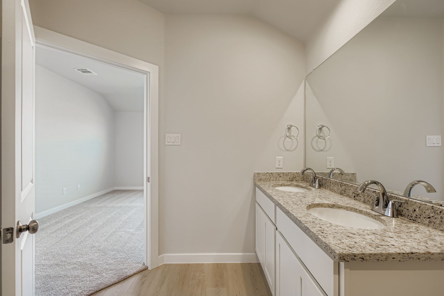 A bathroom with a sink and a shower.