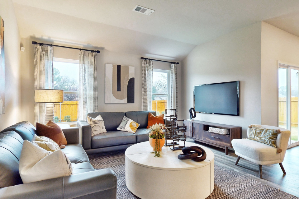 A living room with a tv and couches.