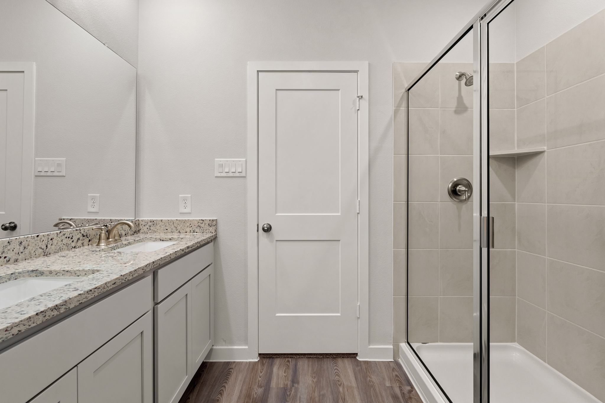 A bathroom with a glass shower.
