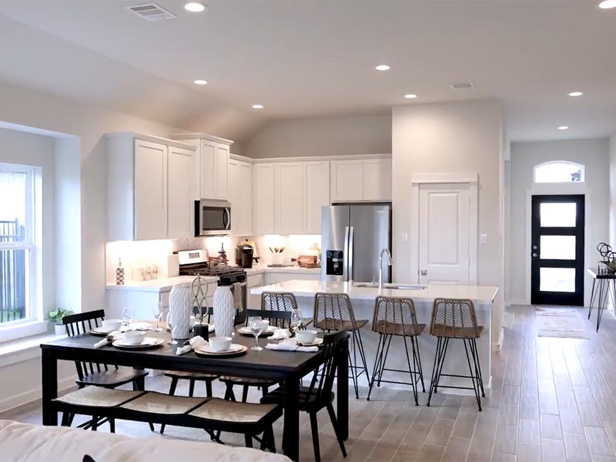 A kitchen with a dining table.