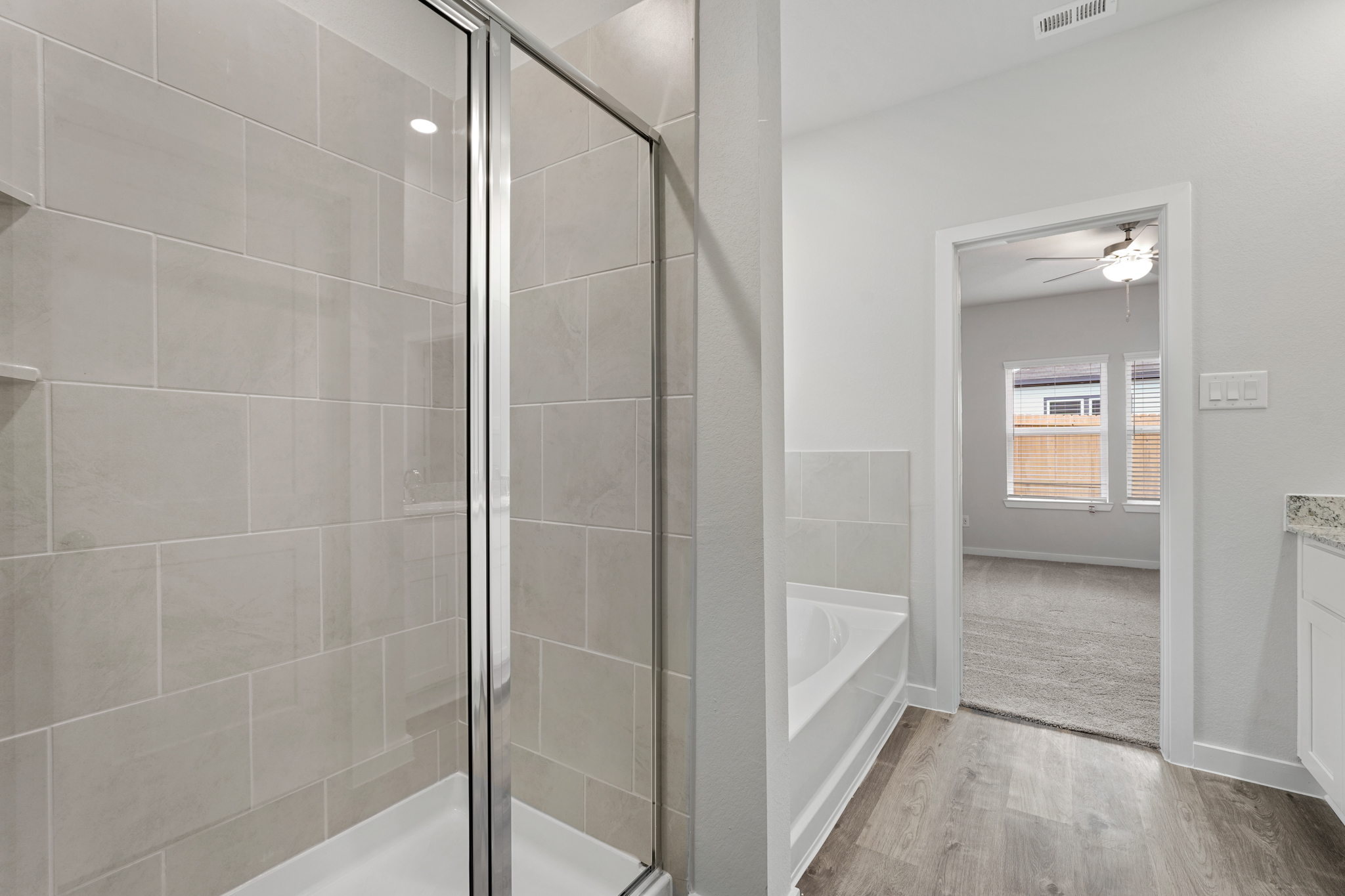 A bathroom with a glass shower.