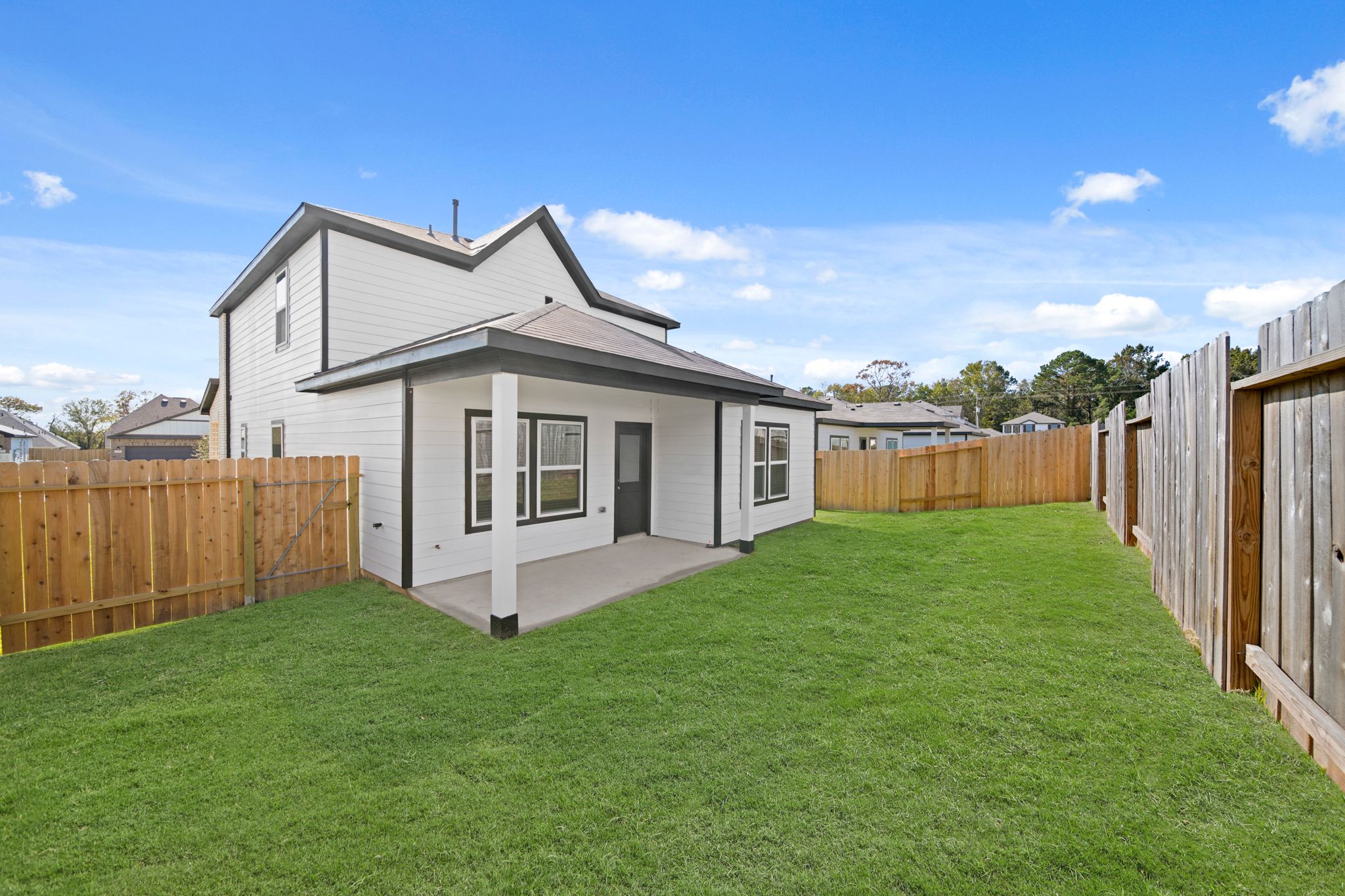 A small house with a fence.