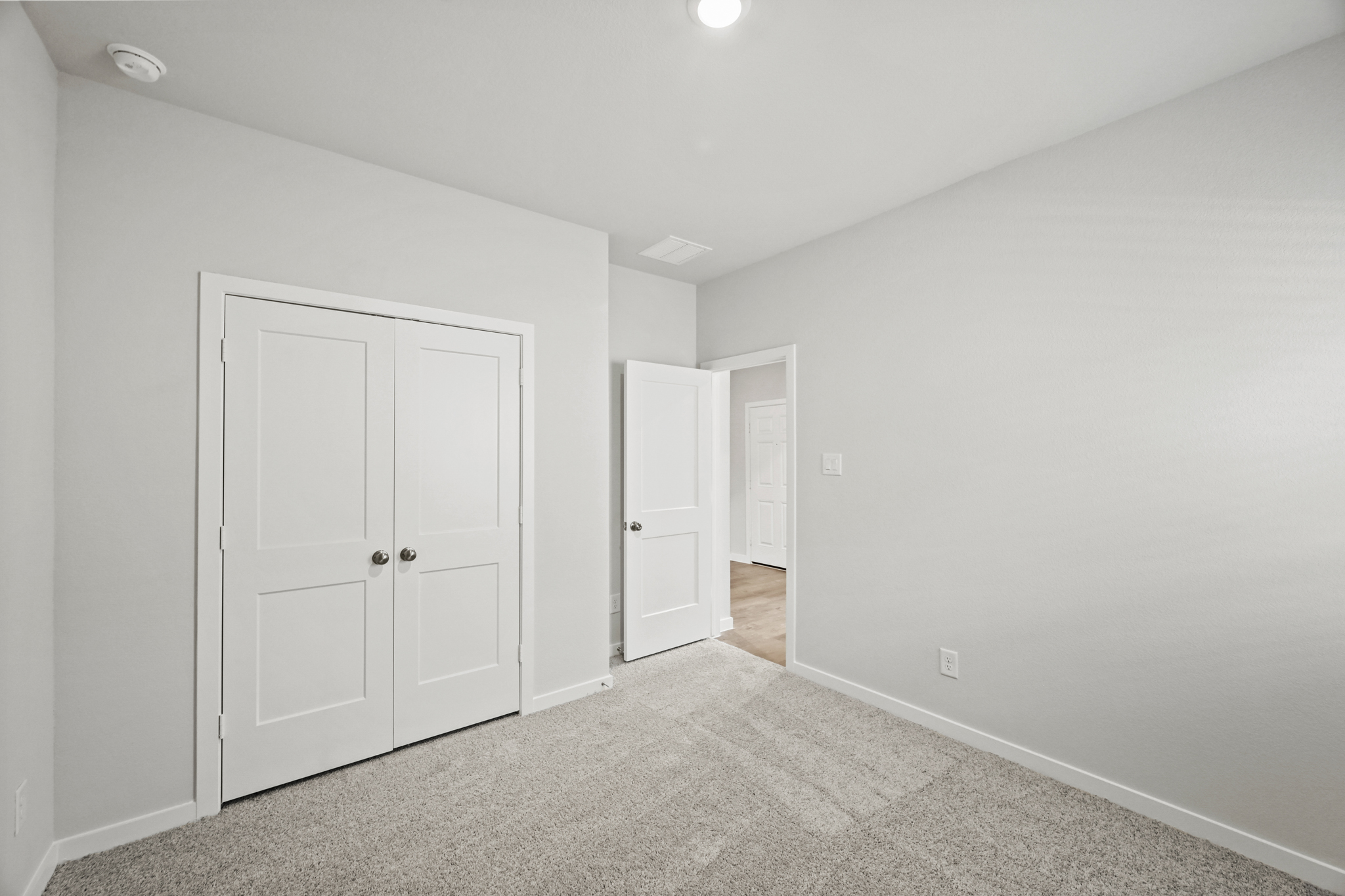 A room with white doors.