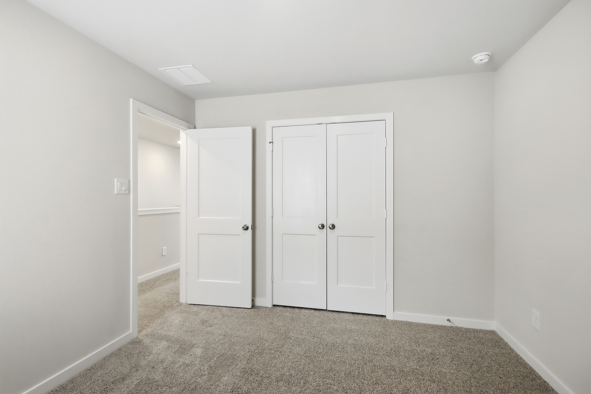 A room with white doors.