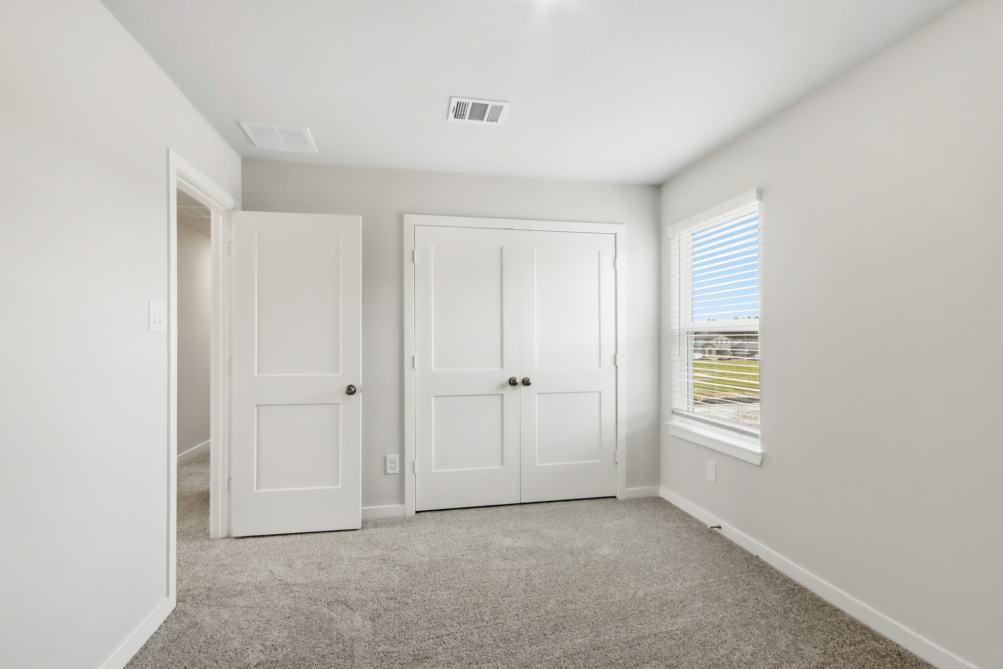 A room with white doors.