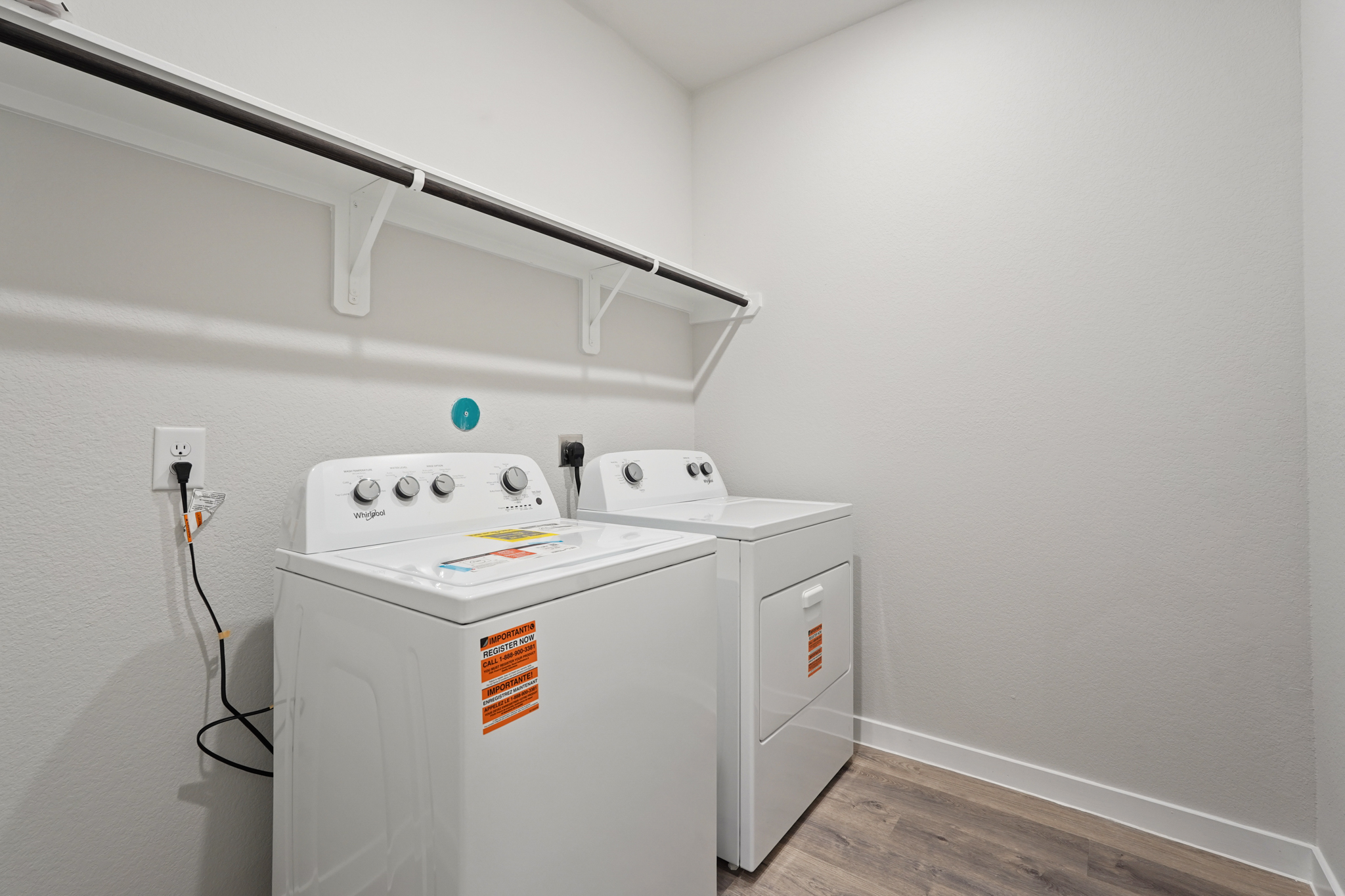 A washing machine in a room.