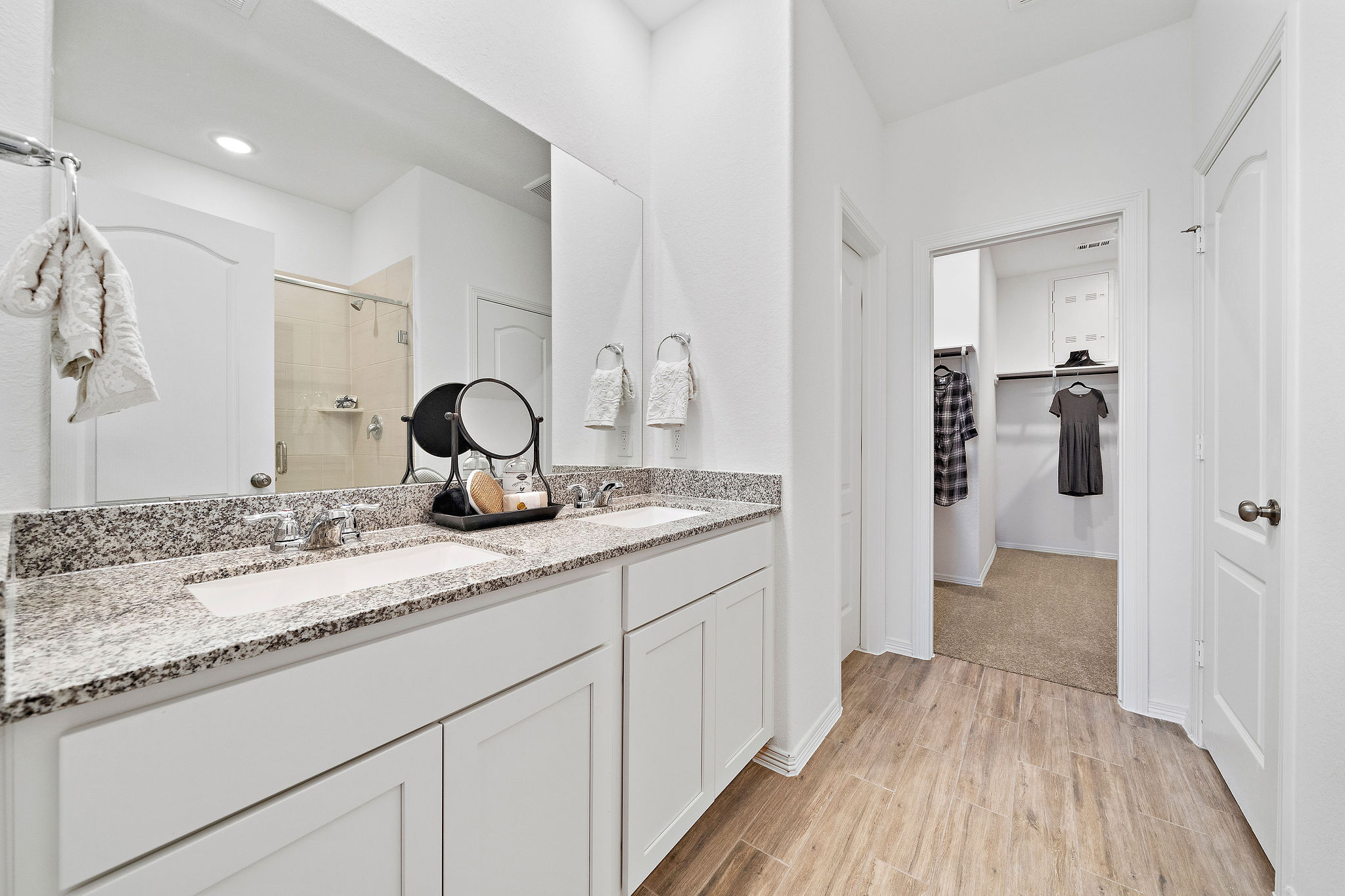 A bathroom with a marble countertop.