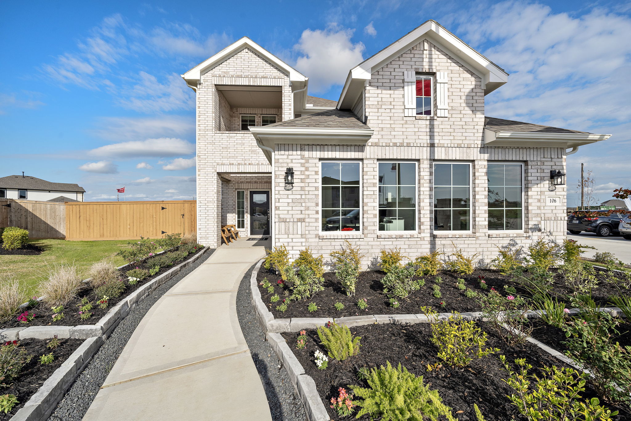 A white house with a driveway.