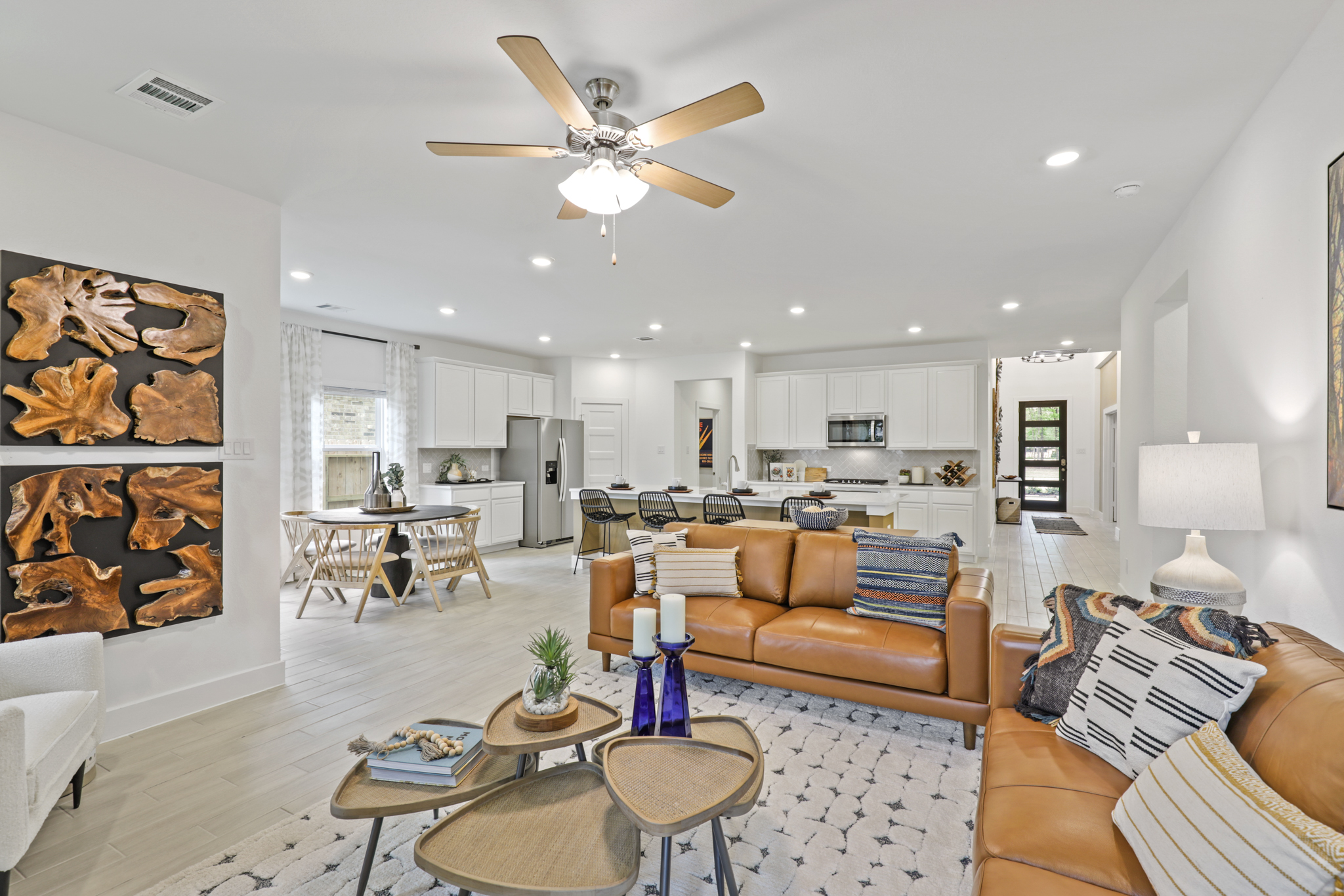 A living room with a ceiling fan.