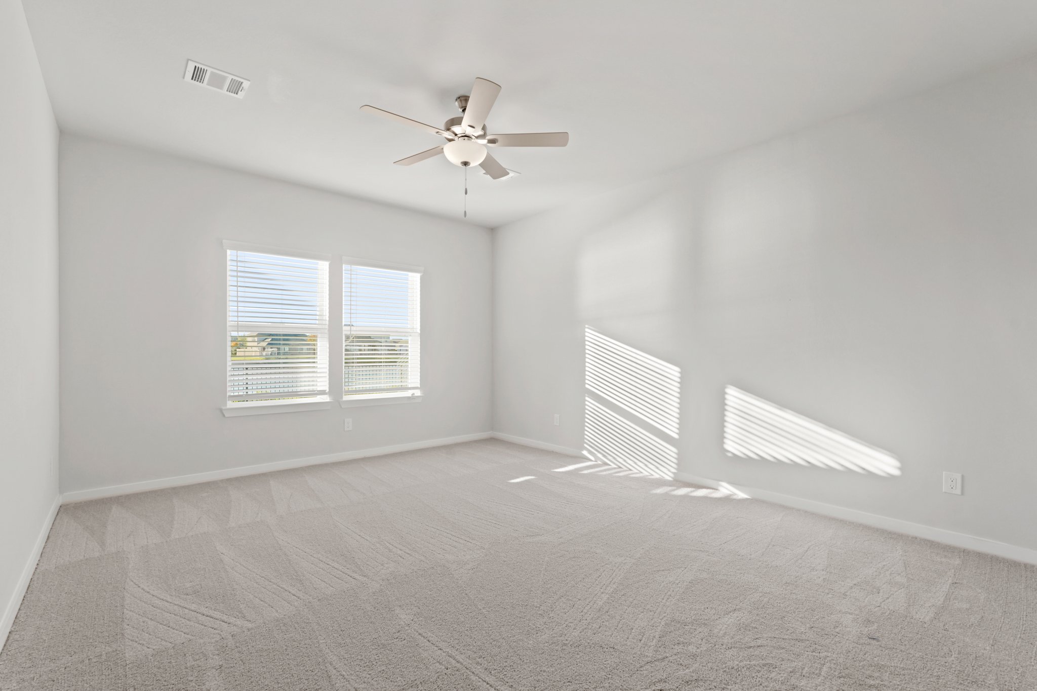A ceiling fan in a room.