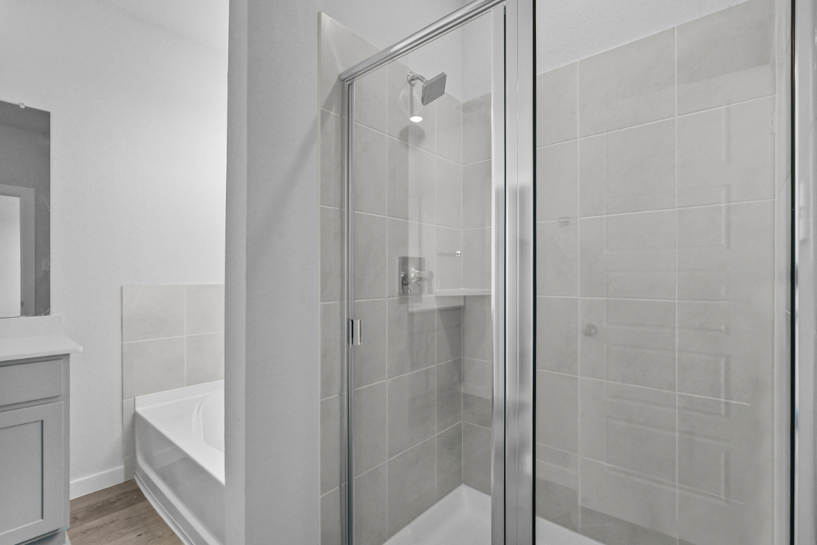 A bathroom with a glass shower.