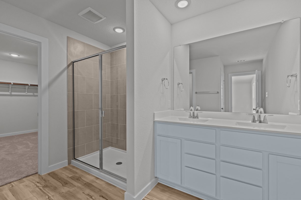 A bathroom with a glass shower.