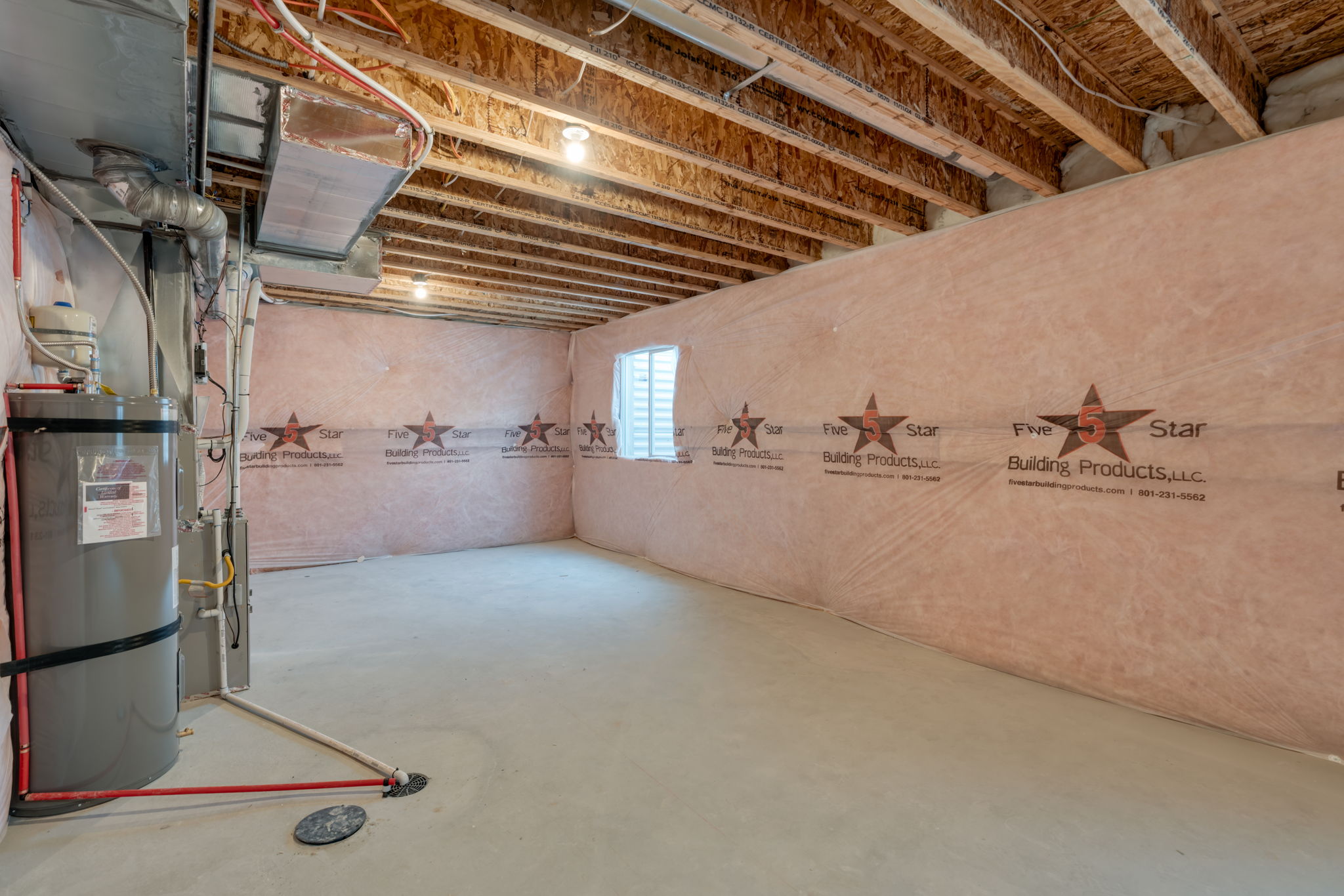 A room with a wall and a large wall with a sign on it.