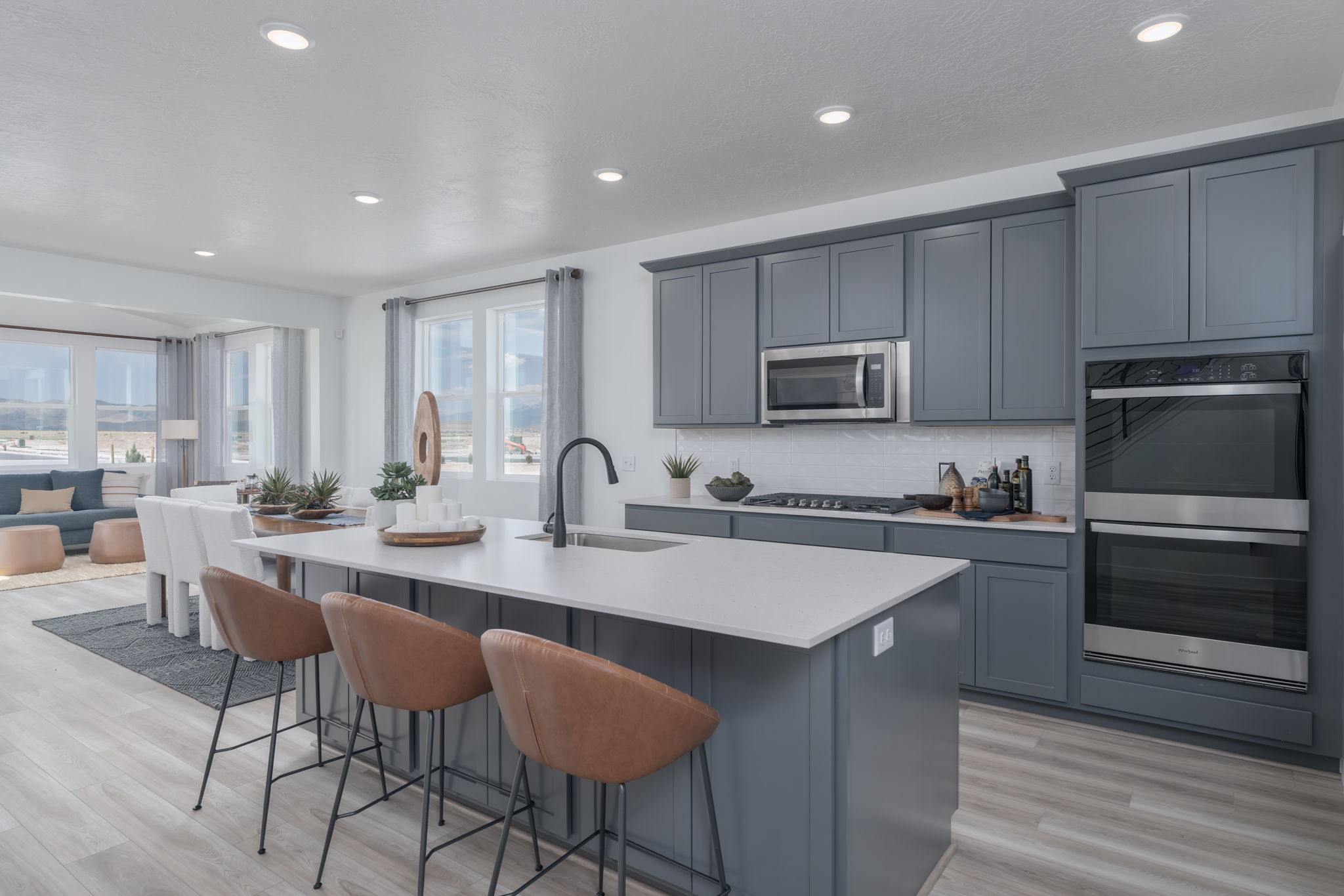 A kitchen with a white island.